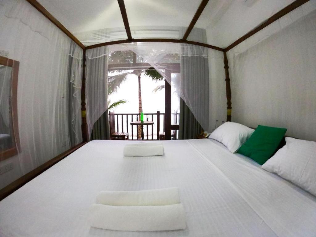 Asa Bay Beach Resort Talpe Eksteriør billede